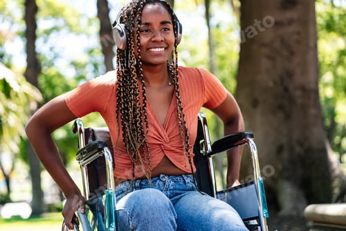 Preview: Happy Woman in Wheelchair Enjoying Sunny Day Outdoors