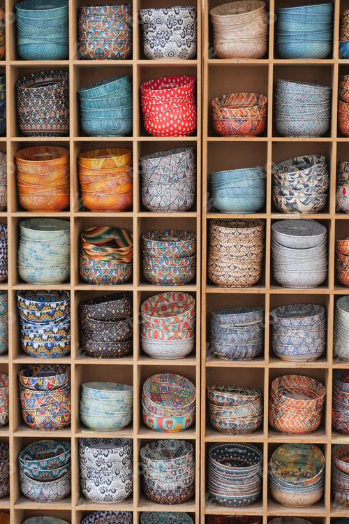Preview: Vibrant and Colorful Storage Baskets Arranged on a Wooden Display Shelf