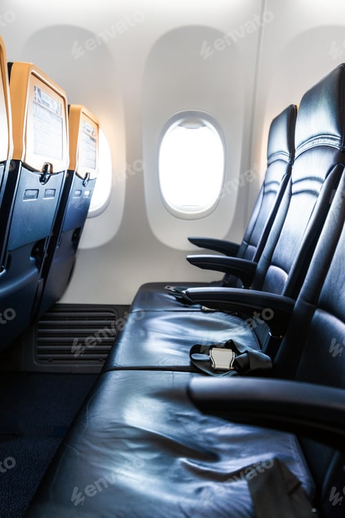 Preview: Plane interior - cabin with modern leather chair for passenger of airplane. Aircraft seats