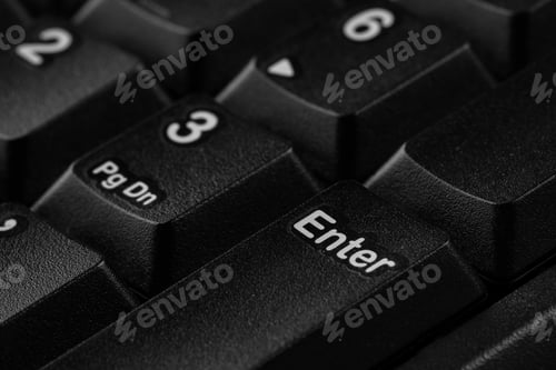 Preview: Closeup view of Enter key on modern computer keyboard