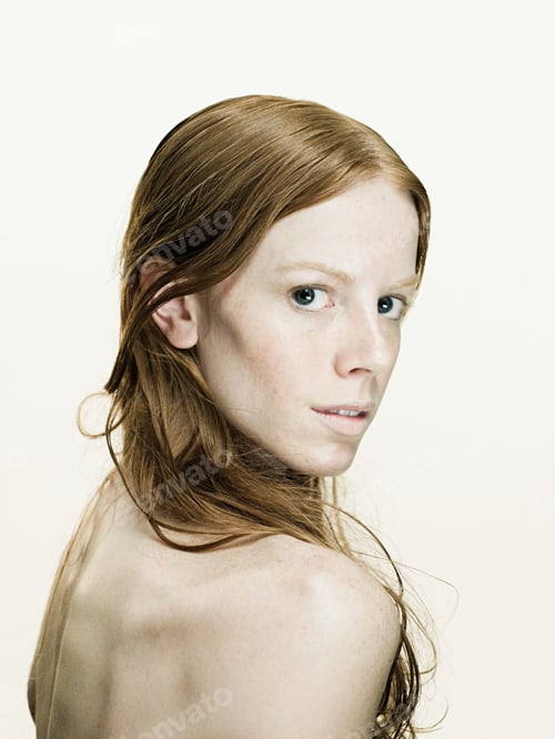 Preview: Young woman looking over shoulder