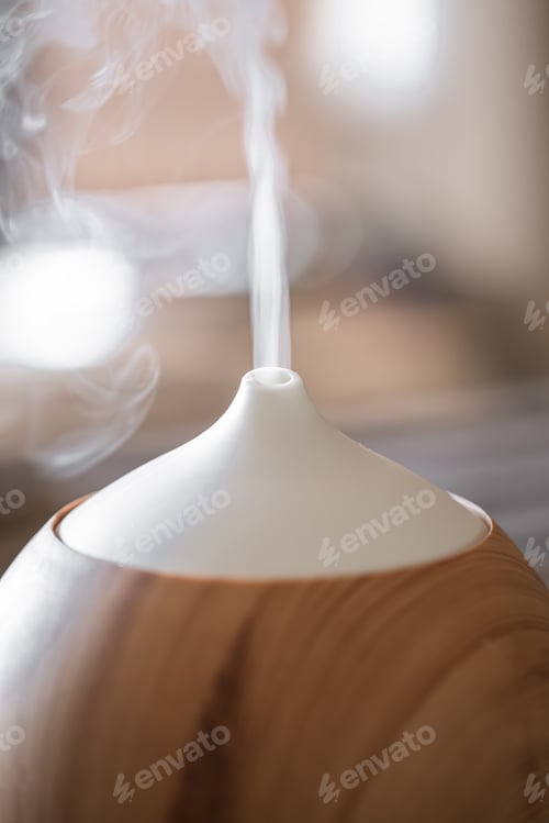 Preview: Modern oil aroma diffuser close up on a blurred background.