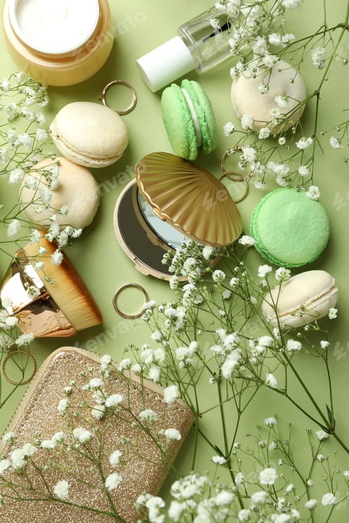 Preview: Female accessories and macaroons on green background