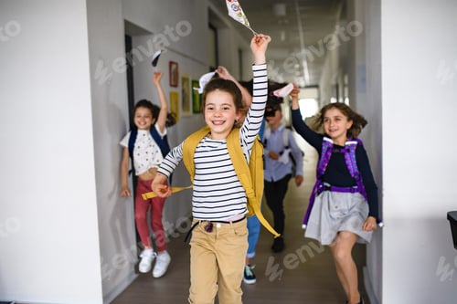 Preview: Group of cheerful children going home from school after covid-19 quarantine and lockdown