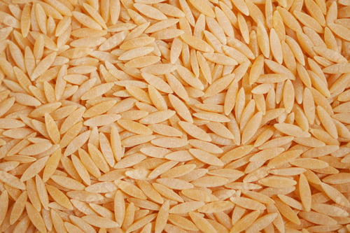 Preview: top view of brown long rice on table .