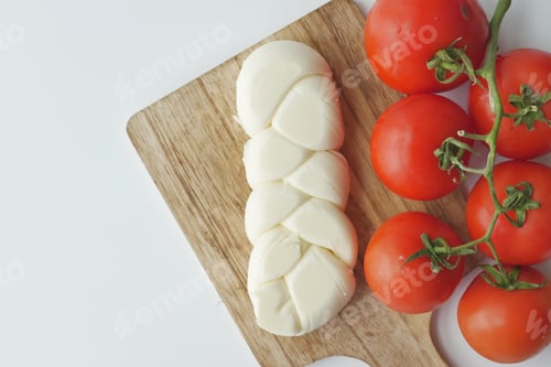 Preview: cheese and tomatoes on white background