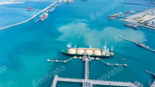 Preview: LNG (Liquefied natural gas) tanker anchored in Gas terminal gas tanks for storage. Oil Crude