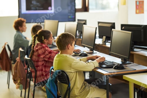 Preview: Group of Children Using Desktop Computers in Classroom Learning Environment