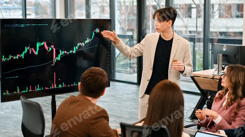 Preview: Young worker leading business meeting about cryptocurrencies in an office