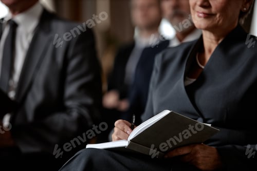 Preview: Middle Aged Caucasian Woman Taking Notes during Business Conference Meeting