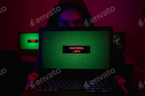 Preview: Man showing laptop with hacking process