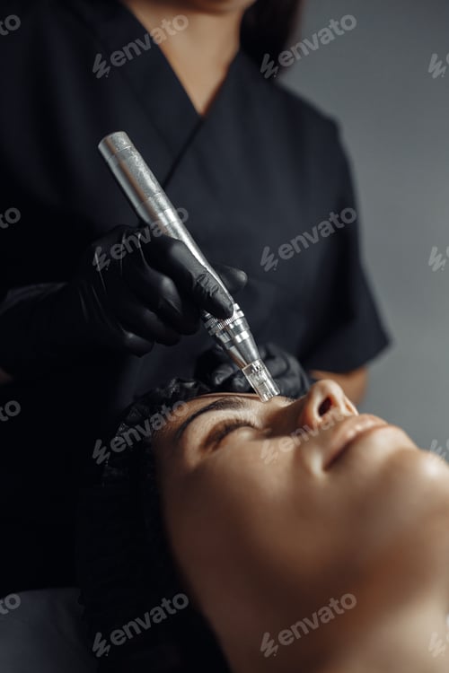Preview: Cosmetologist make procedure for cleaning skin with steel tool from blackheads and acne