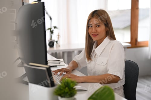 Preview: Young female programmer hands typing on keyboard, writing program code on computer.