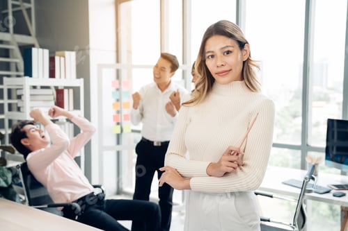 Preview: Businesswoman working and looking camera in a meeting room.