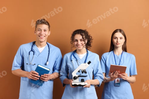 Preview: Group of medical students with microscope on brown background