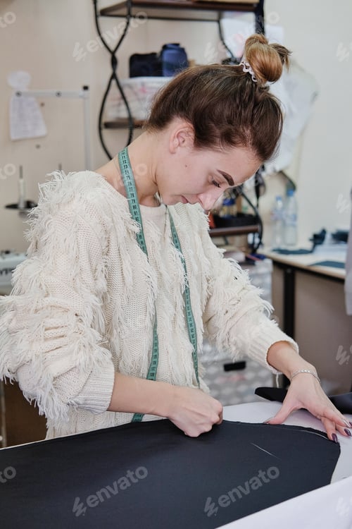 Preview: Female Tailor Working In In The Sewing Workshop.