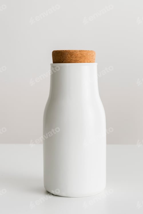 Preview: Minimal white metal container sealed with a cork