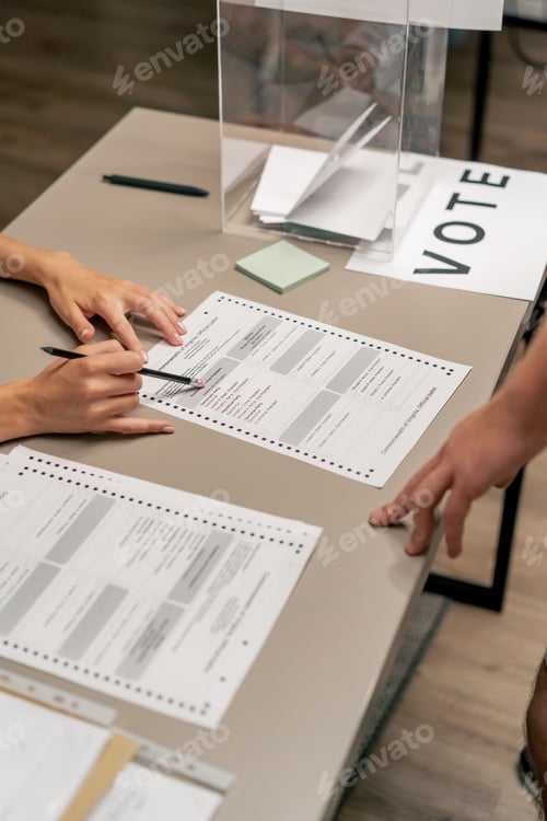 Preview: close up In the selection committee of the election company a guy registers to vote a young girl