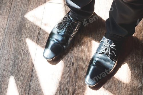 Preview: Close up of man legs in elegant shoes with laces. Fashion and footwear concept