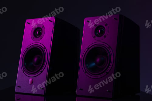 Preview: speaker system with large speakers on a black background with purple atmospheric lighting