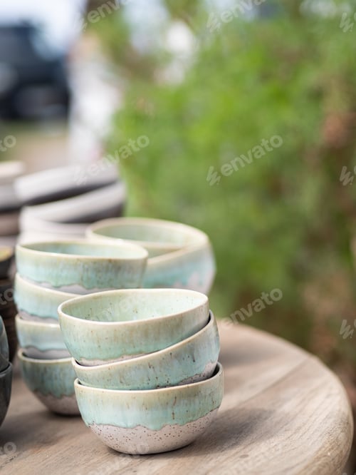 Preview: Handmade ceramic bowls with rustic green glaze on wooden table