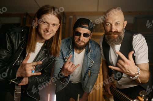 Preview: Crazy rock band artists portrait, funky musicians gesturing rock-and-roll sign