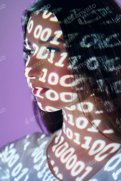 Preview: Binary machine code. Beautiful young woman is in projector neon lights in the studio
