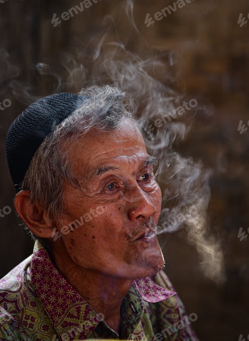 Preview: Portrait of an old man enjoying a cigarette