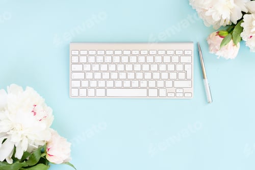 Preview: Flat lay home office workspace on blue