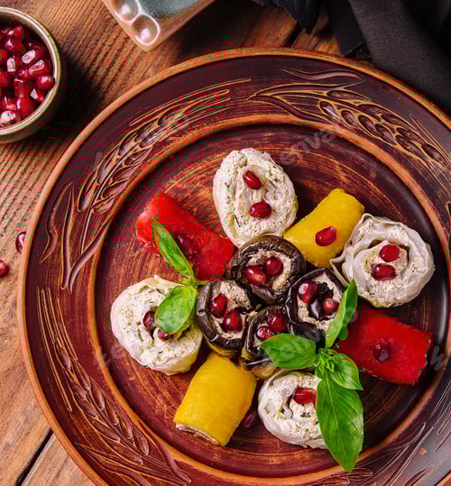 Preview: Gourmet stuffed chicken with pomegranate and basil on wooden table