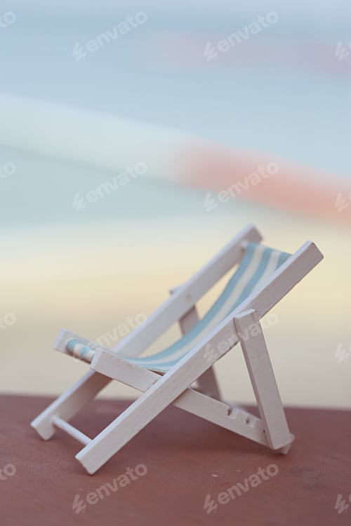 Preview: White wooden beach chair decoration on beach landscape blur nature ocean background