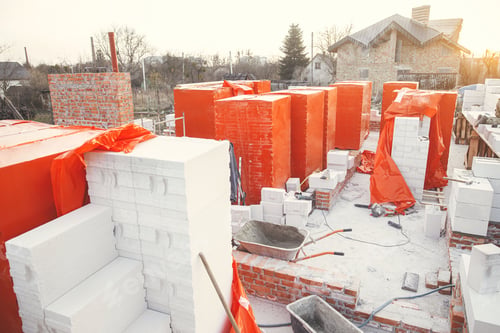 Preview: Building materials at construction site. Autoclaved aerated blocks on concrete foundation