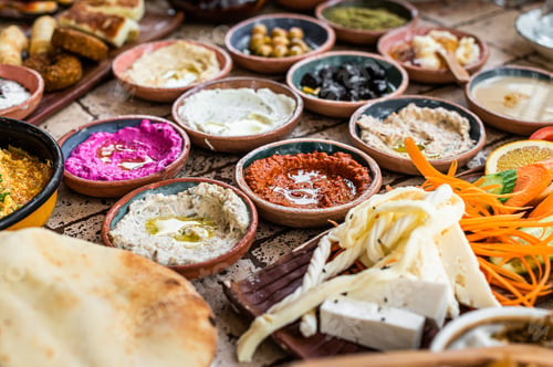 Preview: Turkish Village Breakfast on the ceramic table with pastries, vegetables, greens, spreads