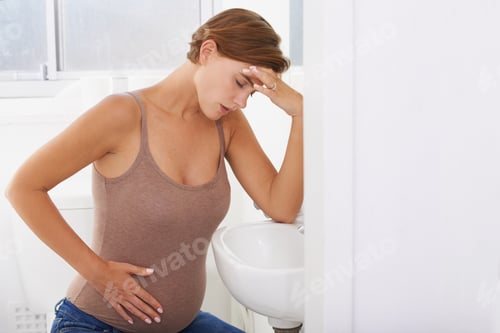 Preview: A pregnant woman struggling with morning sickness in the bathroom