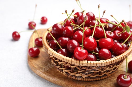 Preview: Fresh ripe cherries on light table, closeup