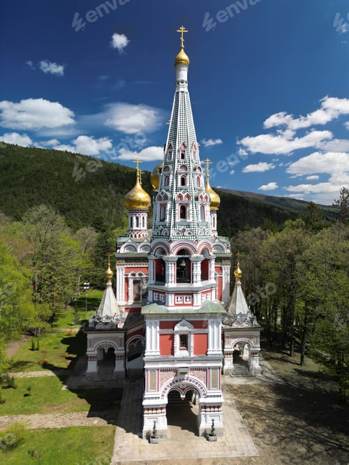 Vista previa: Aerial view of a Russian church with golden globes in Shipka village, surrounded by lush green trees