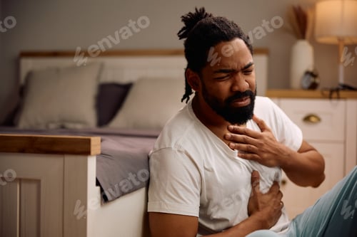 Preview: Ill black man having chest pain after waking up in the morning.