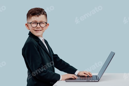 Preview: Cheerful little manger using laptop