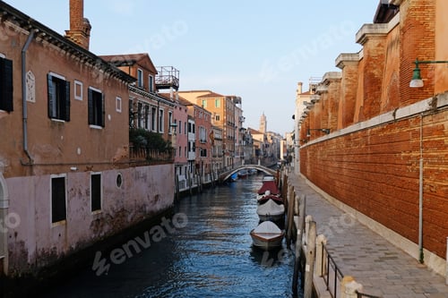 Preview: Typical narrow streets and canals between Colorful and shabby houses in Venice, Italy.