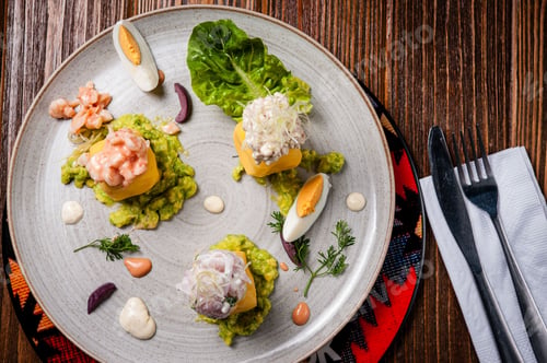 Preview: Gourmet dish with avocado, seafood, and eggs.