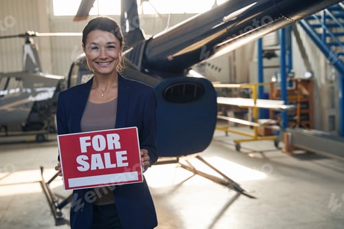 Preview: Cheerful aircraft hangar manager selling private helicopter