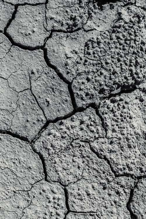 Preview: a cracky patch of mud, on the ground in the desert