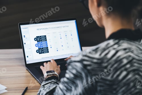 Preview: Crop unrecognizable female trader analyzing diagrams in tablet