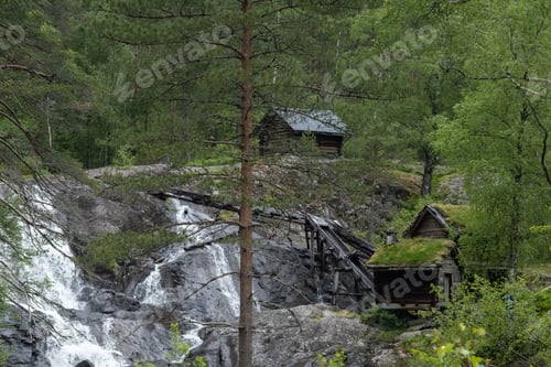 Preview: Beautiful scenery of old waterdriven mills at Suldalsosen.Grassy roofs. Scandinavian landscape.