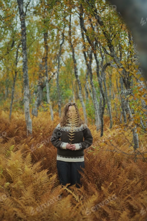 Preview: Caucasian woman standing amongst a dead yellow ferns