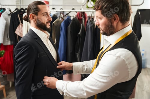 Preview: Man Getting Fitted For a Stylish Suit