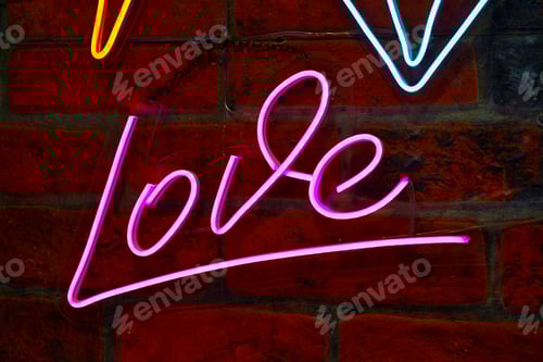 Preview: Glowing Neon Love Sign on Brick Wall