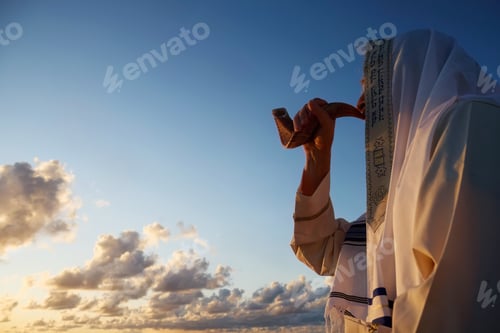 Preview: Jewish man blowing the Shofar horn of Rosh Hashanah. New Year.