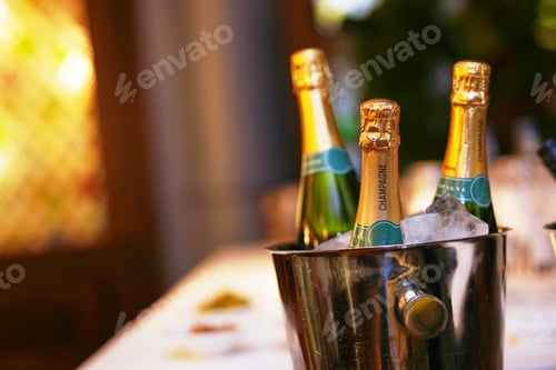 Preview: Bottles of champagne on ice bucket