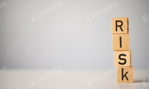 Preview: wooden block with the word "RISK". Concept risk management